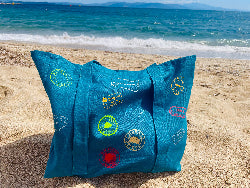A versatile, eco-friendly travel tote bag made from 100% canvas cotton fabric, featuring hat straps, multiple pockets for organization, and customizable visa stamp stickers. Available in 15 vibrant colors, it's the perfect companion for globetrotters, offering durability and style for any adventure.